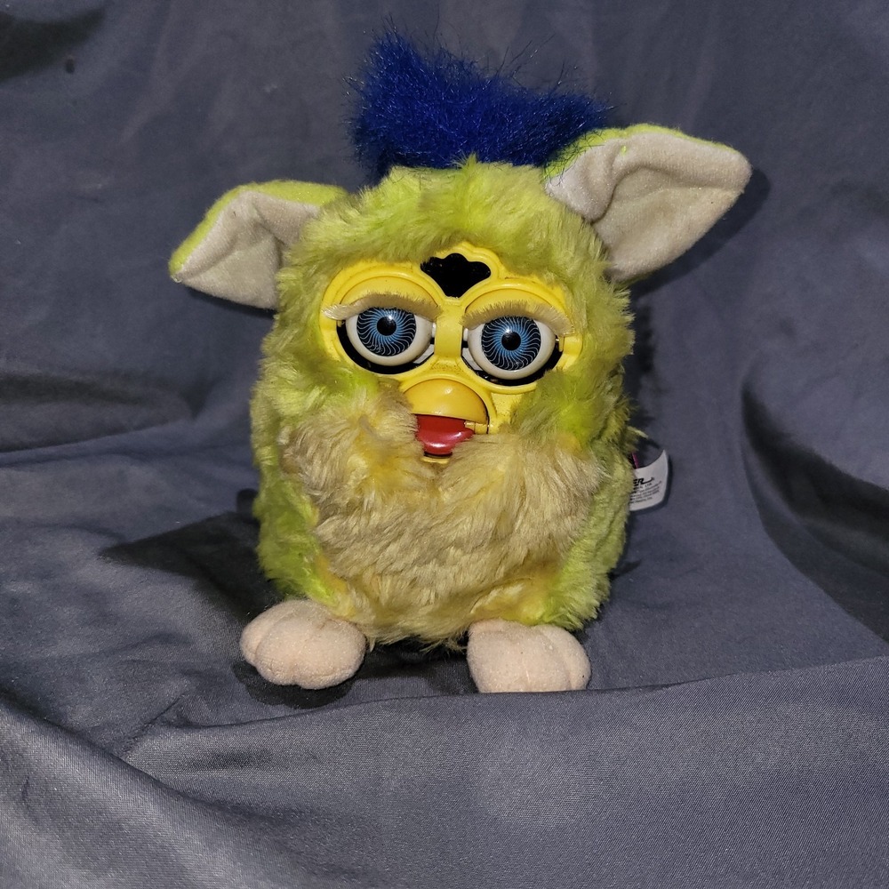 Vintage 1998 "Kiwi" Furby features lime green body, yellow belly, and blue tuft